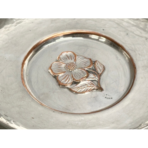 176 - Jefferies & Co. A Victorian B.C hammered silver on copper bowl, with embossed flower motif. 15cm.