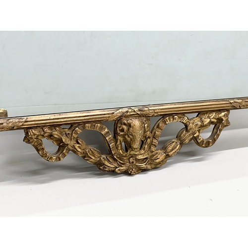 226 - An Early/Mid 20th Century gilt framed mirror. In the 18th Century style. 81x76cm