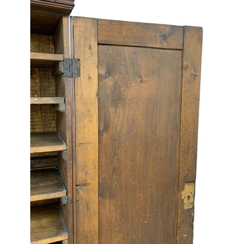 25 - A Victorian pine 2 door cupboard with fitted shelves in original scumble paint. Circa 1870. 110 x 36... 