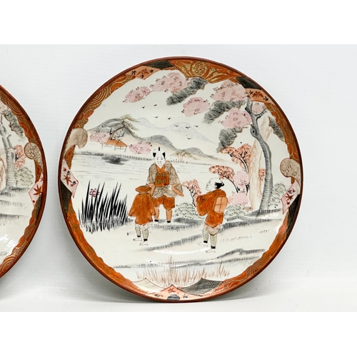 383B - A pair of signed Late 19th Century Japanese Kutani shallow bowls. 21x3cm