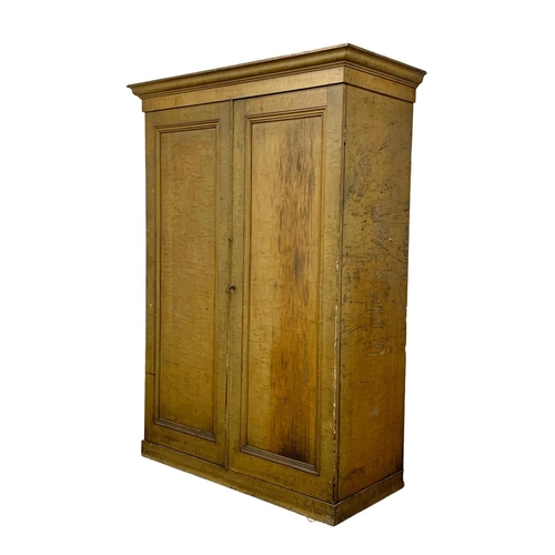 382E - A large Victorian pine 2 door cupboard with original scumble finish and fitted shelves. Circa 1870. ... 