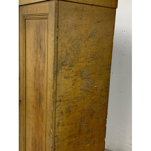 382E - A large Victorian pine 2 door cupboard with original scumble finish and fitted shelves. Circa 1870. ... 