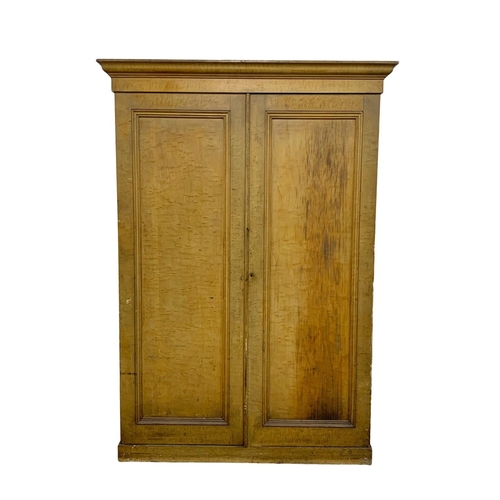 382E - A large Victorian pine 2 door cupboard with original scumble finish and fitted shelves. Circa 1870. ... 