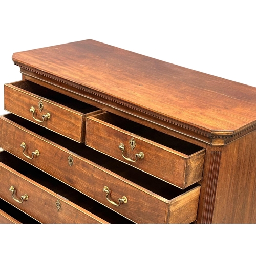 13 - An 18th Century, George III mahogany chest of drawers. With dental cornice, reeded canted corners, o... 