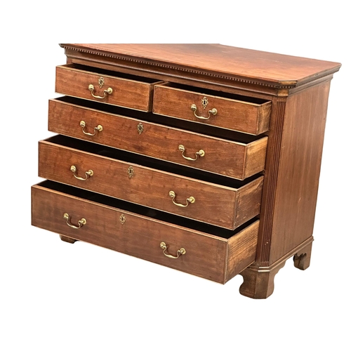 13 - An 18th Century, George III mahogany chest of drawers. With dental cornice, reeded canted corners, o... 