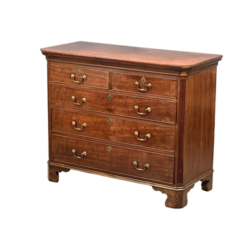 13 - An 18th Century, George III mahogany chest of drawers. With dental cornice, reeded canted corners, o... 