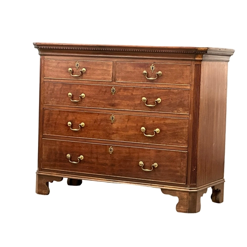 13 - An 18th Century, George III mahogany chest of drawers. With dental cornice, reeded canted corners, o... 