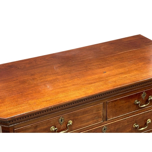 13 - An 18th Century, George III mahogany chest of drawers. With dental cornice, reeded canted corners, o... 