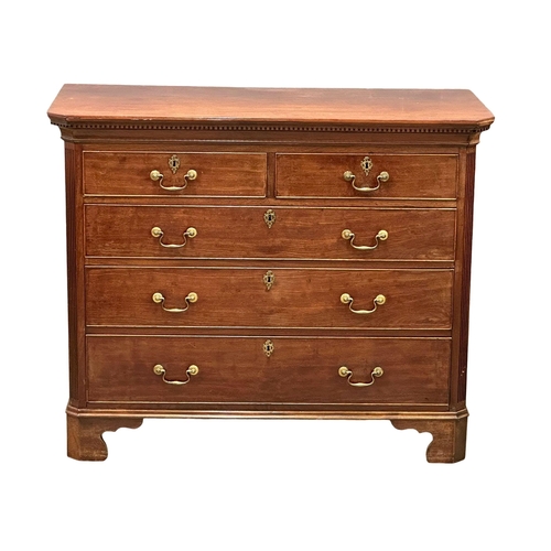 13 - An 18th Century, George III mahogany chest of drawers. With dental cornice, reeded canted corners, o... 