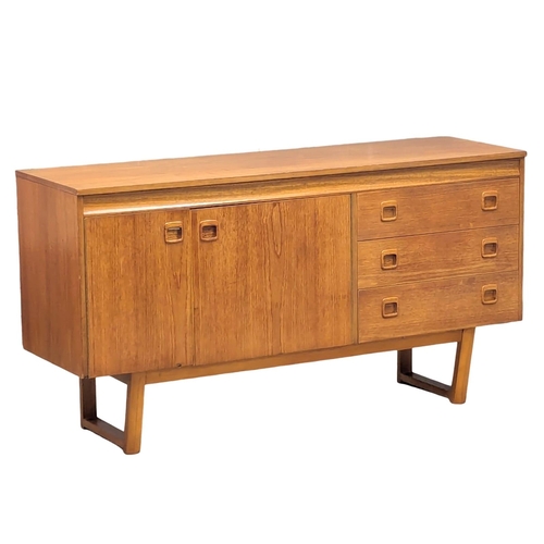 155 - A Mid Century teak sideboard. 137.5x42.5x73.5cm. 2