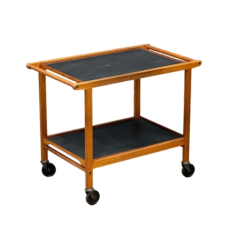 156 - Staples & Co. A 1960’s Mid Century teak serving trolley with 2 removable trays. 77x45x63cm. 1