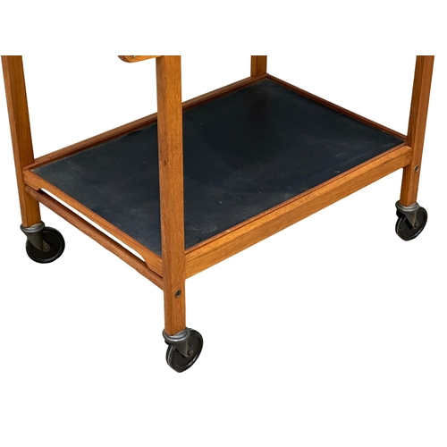 156 - Staples & Co. A 1960’s Mid Century teak serving trolley with 2 removable trays. 77x45x63cm. 1