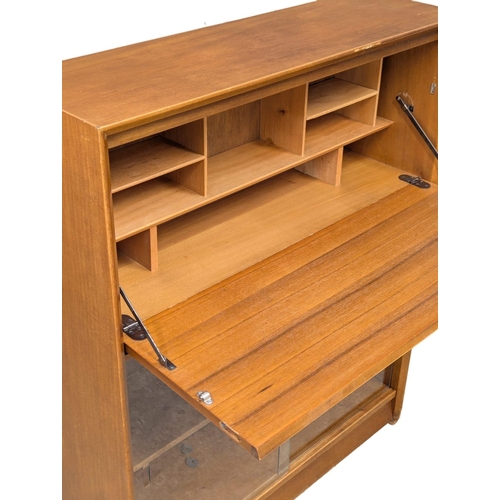 159 - A Mid Century teak bureau bookcase by Herbert Gibbs. 91.5x27.5x112.5cm. 2