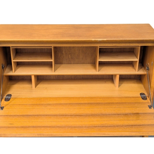 159 - A Mid Century teak bureau bookcase by Herbert Gibbs. 91.5x27.5x112.5cm. 2