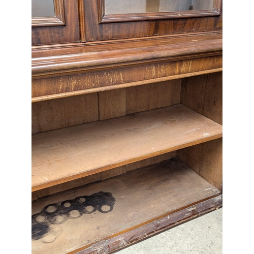 197 - A large 19th Century Victorian mahogany double glazed door bookcase with adjustable shelves. 146x50x... 