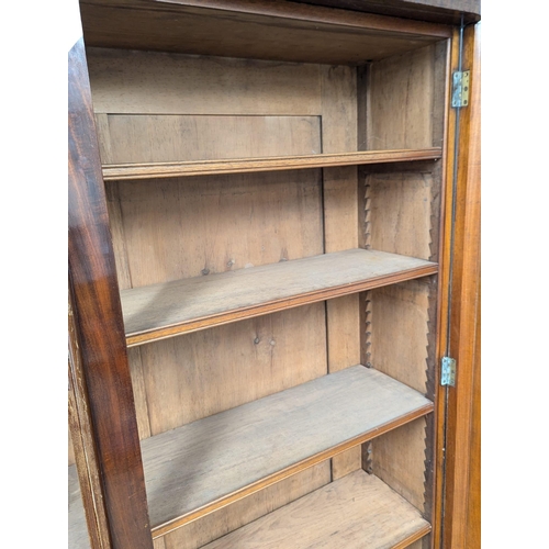 197 - A large 19th Century Victorian mahogany double glazed door bookcase with adjustable shelves. 146x50x... 