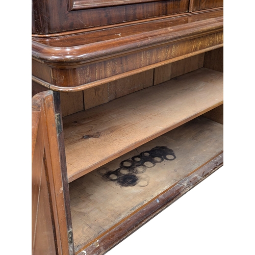 197 - A large 19th Century Victorian mahogany double glazed door bookcase with adjustable shelves. 146x50x... 