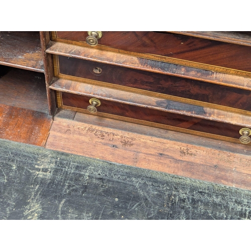 198 - An Early 19th Century George IV inlaid mahogany secretaire writing table. 99x63x82cm. 1