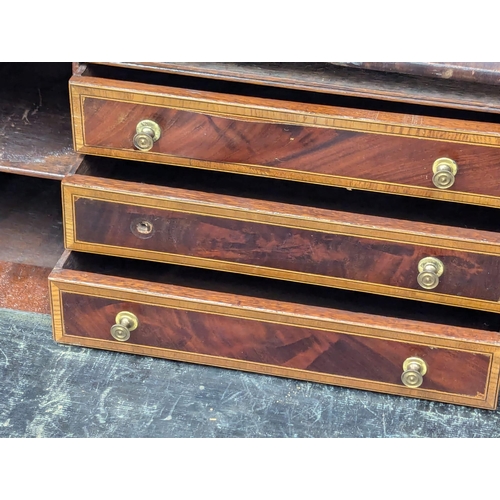 198 - An Early 19th Century George IV inlaid mahogany secretaire writing table. 99x63x82cm. 1