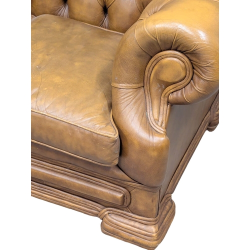 202A - A Victorian style deep button back leather sofa. 150cm. 5