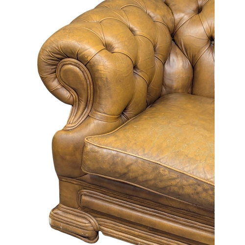 202B - A Victorian style deep button back leather sofa. 150cm. 4