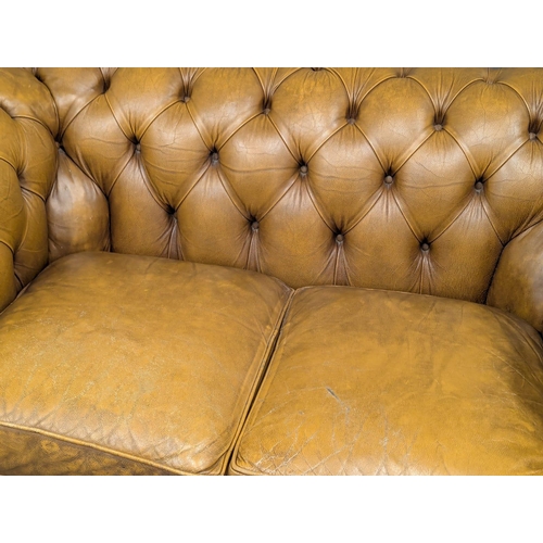 202B - A Victorian style deep button back leather sofa. 150cm. 4