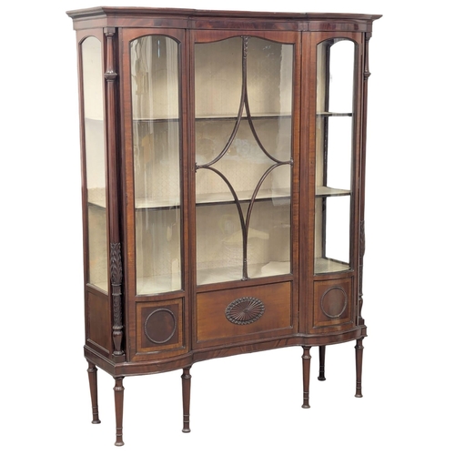 206 - A large Edwardian mahogany display cabinet with astragal glazed and bow front panel door . Circa 190... 