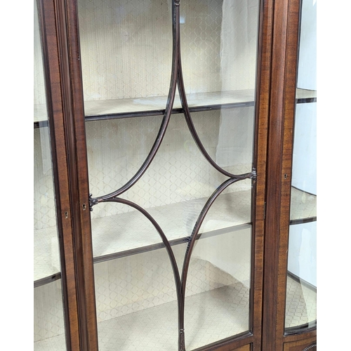 206 - A large Edwardian mahogany display cabinet with astragal glazed and bow front panel door . Circa 190... 