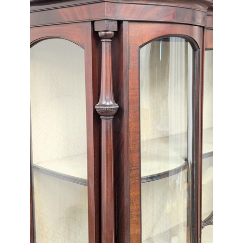 206 - A large Edwardian mahogany display cabinet with astragal glazed and bow front panel door . Circa 190... 