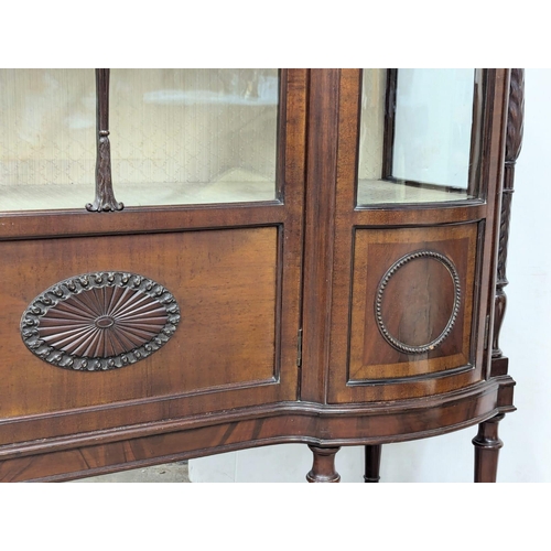 206 - A large Edwardian mahogany display cabinet with astragal glazed and bow front panel door . Circa 190... 