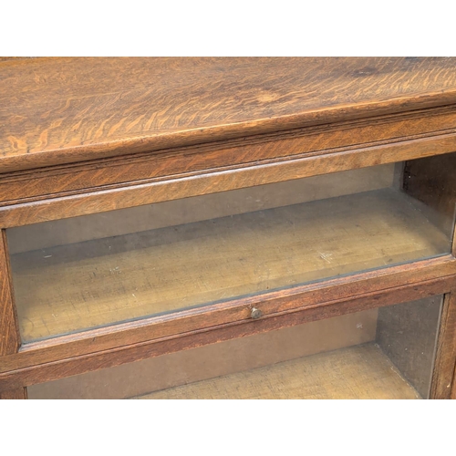 222 - An Early 20th Century oak stacking bookcase. 87x36x89.5cm. 2