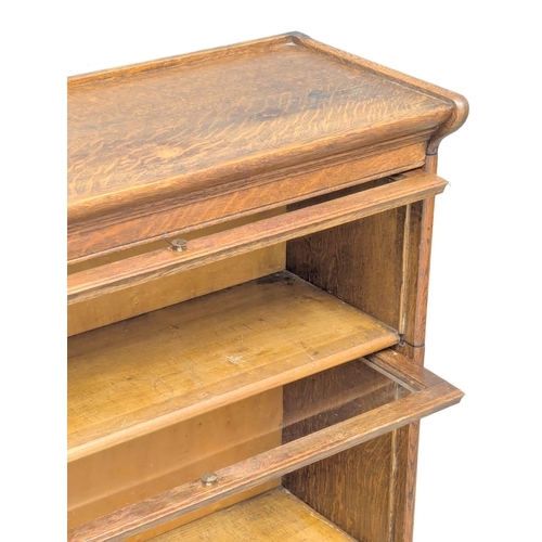 222 - An Early 20th Century oak stacking bookcase. 87x36x89.5cm. 2