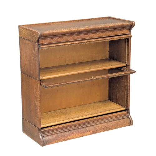 222 - An Early 20th Century oak stacking bookcase. 87x36x89.5cm. 2