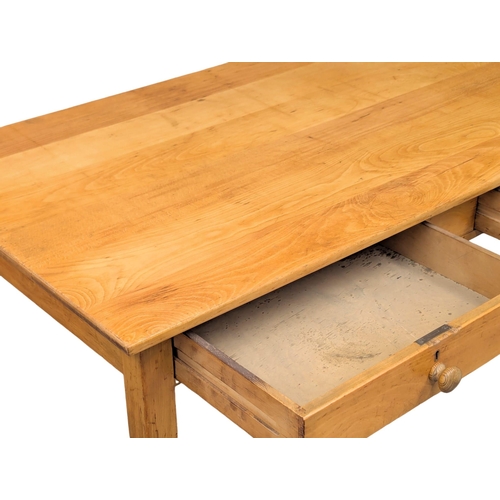 224 - A 1950s beech kitchen table with 2 drawers on square tapering legs. 137x77x76cm. 2