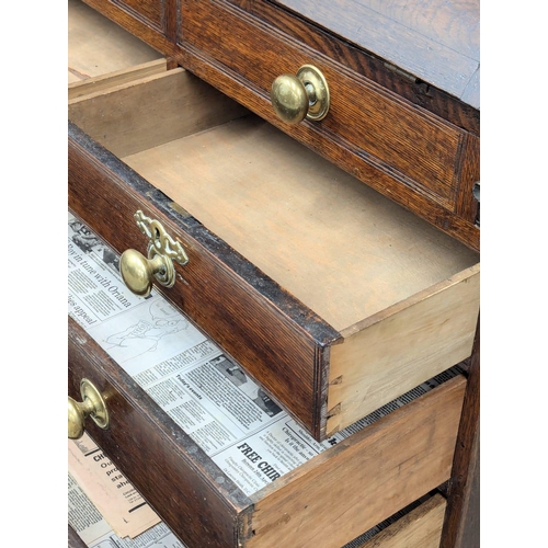 229 - An Early 19th Century George III oak bureau with brass bun handles and bracket feet. Circa 1800. 97x... 