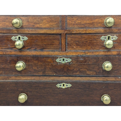 229 - An Early 19th Century George III oak bureau with brass bun handles and bracket feet. Circa 1800. 97x... 