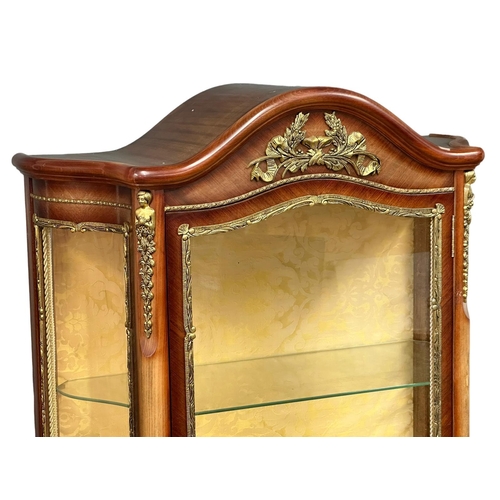 232 - An 18th Century style French simulated Linwood vitrine with brass mounts. 78x34x178cm. 7