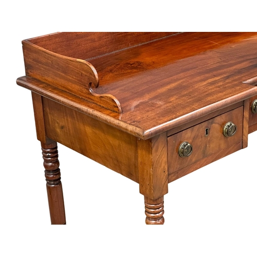 234 - An Early 19th Century, Late George IV mahogany breakfront side table with gallery back and turned le... 