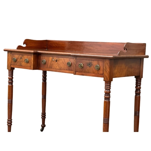 234 - An Early 19th Century, Late George IV mahogany breakfront side table with gallery back and turned le... 