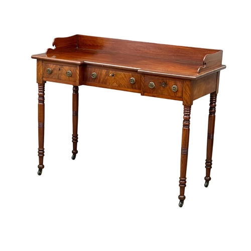 234 - An Early 19th Century, Late George IV mahogany breakfront side table with gallery back and turned le... 