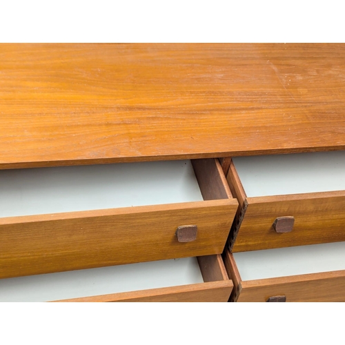 239 - A Mid Century teak sideboard by Symbol. 150x42x72.5cm. 2