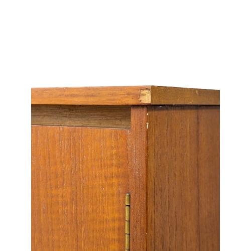 242 - A Mid Century teak wardrobe by Symbol. 122x57x172cm. 1