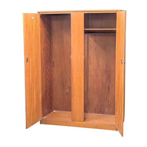 242 - A Mid Century teak wardrobe by Symbol. 122x57x172cm. 1