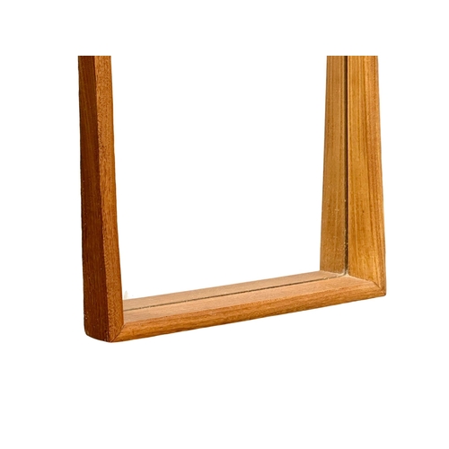 253 - A 1960’s Mid Century teak framed mirror. 33x94cm