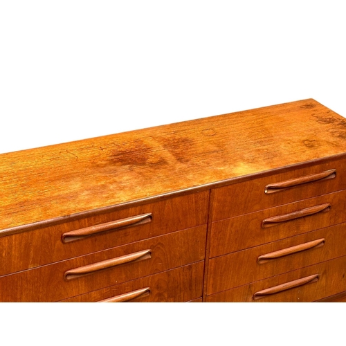 256 - A large GPlan Fresco Mid Century teak chest of drawers. Designed by Victor Wilkins. 142x44.5x76cm. 3