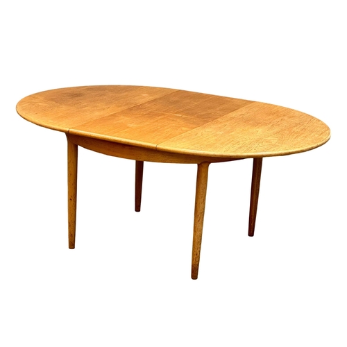 257 - A Mid Century “Cheetham” teak extending dining table. Open 170x122x73cm. Closed 122x73cm. 4