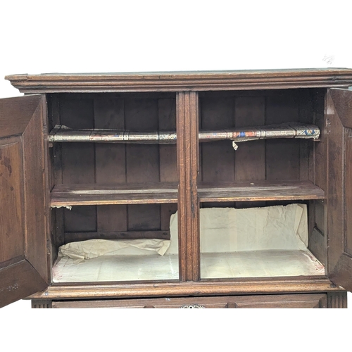 275 - A large late 17th/Early 18th century North European 2 piece oak court cupboard with geometric handle... 