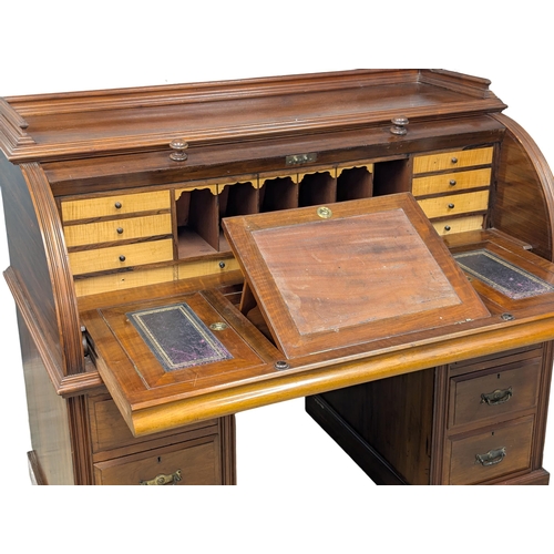 29 - A large 19th century Victorian walnut cylinder top desk. With Birdseye maple interior drawers. 137cm... 