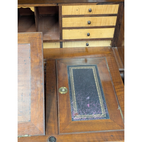 29 - A large 19th century Victorian walnut cylinder top desk. With Birdseye maple interior drawers. 137cm... 