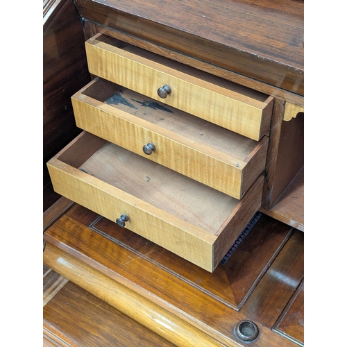 29 - A large 19th century Victorian walnut cylinder top desk. With Birdseye maple interior drawers. 137cm... 